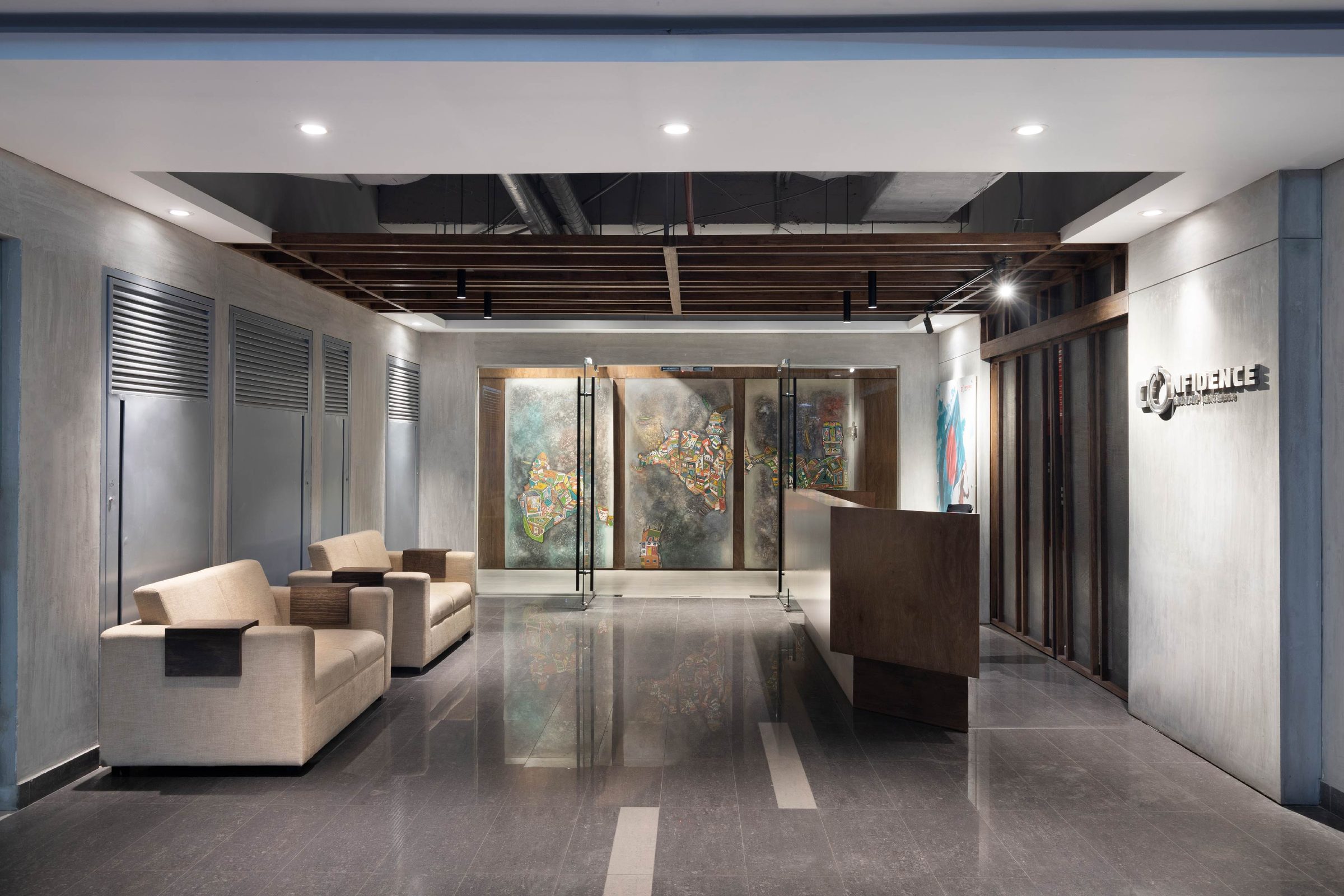 Confidence Group head office corporate interior design Karwanbazar Dhaka Bangladesh by REINCARNATION — reception with custom screens and the Confidence Group wordmark