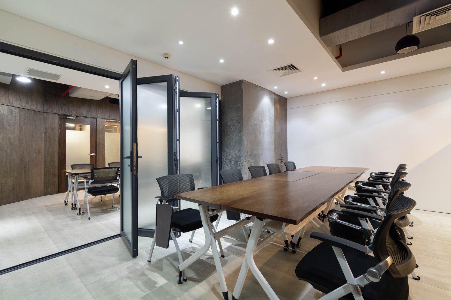 Confidence Group head office corporate interior design Karwanbazar Dhaka Bangladesh by REINCARNATION — meeting room with folding glass partition